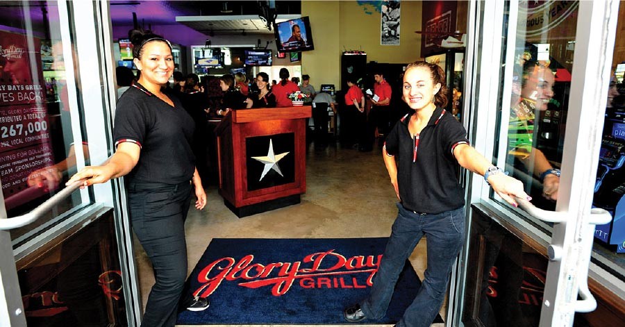 Glory Days Grill employees welcoming diners to the restaurant